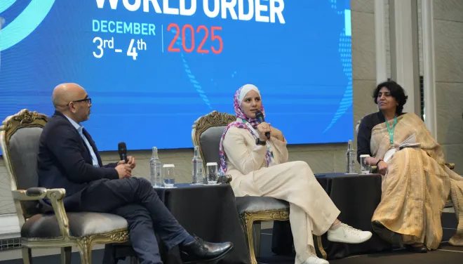 Shamim Miah leads a panel discussion